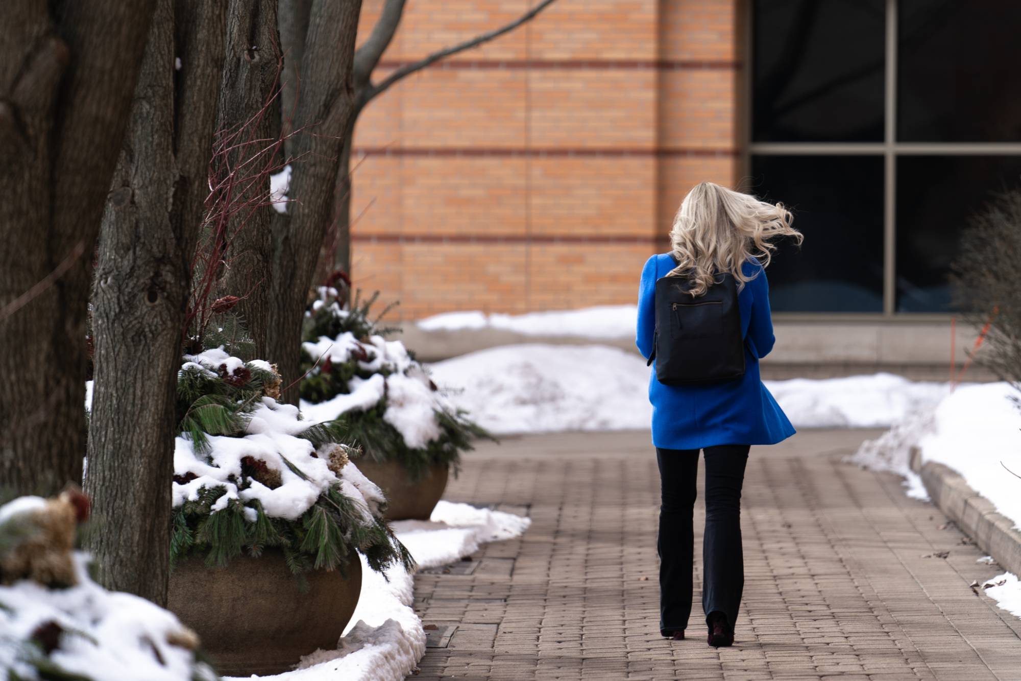 Girl walking to class in the snow